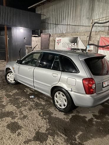 Haima: Mazda Familia: 2002 г., 1.6 л, Кол менен иштөөчү, Бензин, Хетчбек — 2