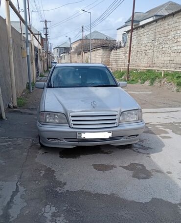 aston martin db9 5.9 at: Mercedes-Benz C 180: 1.8 l | 1995 il Sedan