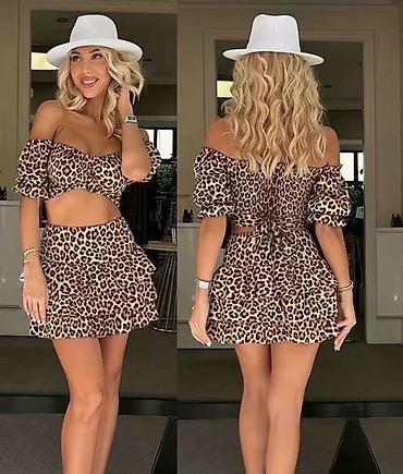 kiko: Dvodijelni ženski set – top i mini suknja s volanima
3300 din
S M L — 1