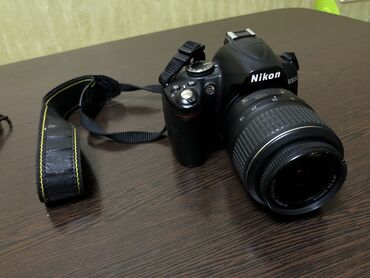 фотоаппарат любитель: Зеркальный фотоаппарат Nikon D3000 kit Полный комплект: • Тушка •