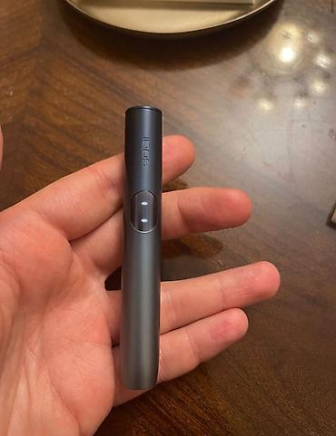 IQOS 3 DUO tütün qızdırıcı cihazı – zeytun-yaşıl rəngli şarj qutusu və