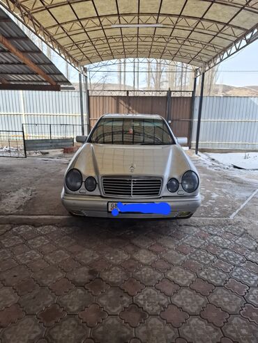 шины бишкек дордой цены: Седан Mecedes-Benz E-класса серебристого цвета, представленный на