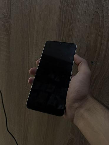Мобильные телефоны и аксессуары: Redmi 13C, 128 ГБ, цвет - Голубой, Отпечаток пальца, Face ID — 2