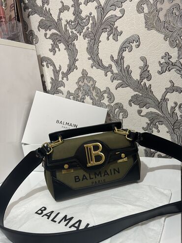 muncuq çanta: Xaki çanta.70manata alınıb 30manata satılır.Balmain markasıdır.1defe