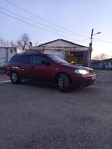 tap az opel vectra: Opel Astra универсал kuzovlu minik avtomobil. Rəngi tünd qırmızı — 3