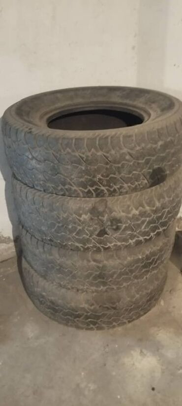 Шины: Комплект из четырех всесезонных шин размера 265/70R16 с маркировкой