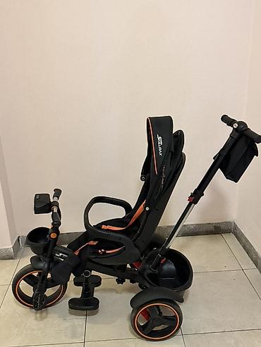 Детский трехколесный велосипед-коляска (тип «trike») с родительской