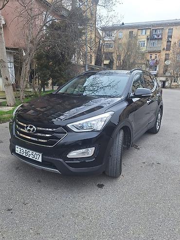 ford focus hatchback: Hyundai Santa Fe: 2 l | 2014 il Krossover — 1