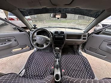 Mazda: Mazda Demio: 2002 г., 1.5 л, Автомат, Бензин, Купе — 6