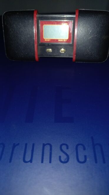 ikona u duborezu: Sklopivi interesantan sat sa alarmom, proizvedeno u Svajcarskoj