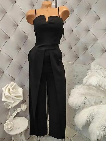 Kombinezoni: Elegantni ženski kombinezon sa širokim nogavicama - Model: kombinezon — 8