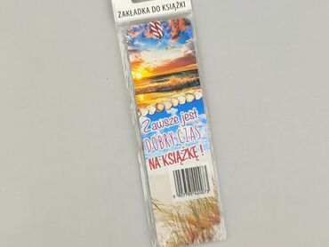 Zakładka do książki z motywem plaży. Widoczny jest zachód słońca nad