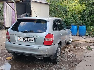 пороги демио: Mazda 323: 2001 г., 1.6 л, Механика, Бензин, Хэтчбэк — 5