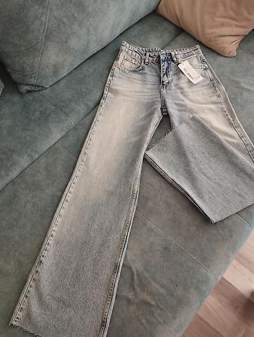 Cinslər: TrendYol qadın cins şalvarı - Model: geniş kəsimli (wide leg), düz — 2