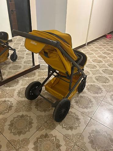 Uşaq arabaları: Uşaq arabası – Kidilo, sarı rəng Xüsusiyyətlər: - Geniş, rahat — 4