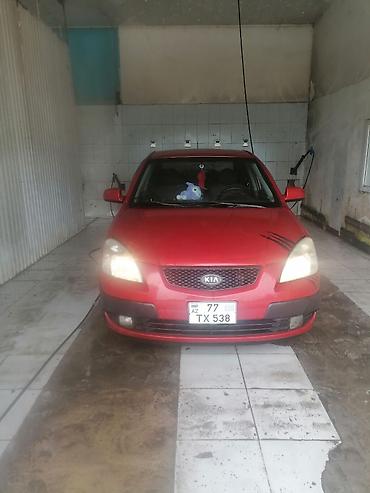 saipa saina lizing: Kia Pride LX sedan – qırmızı rəngdə, avtomatik sürətlər qutusu maşinin — 1