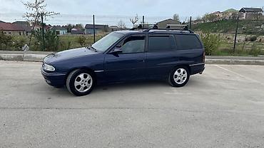 e39 rul: Opel Astra F Caravan (universa) – tünd mavi rəngdə, nömrə 10-RG-592 — 4