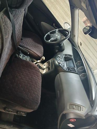 смешанный: Nissan Primera: 2002 г., Бензин, Лифтбек — 6