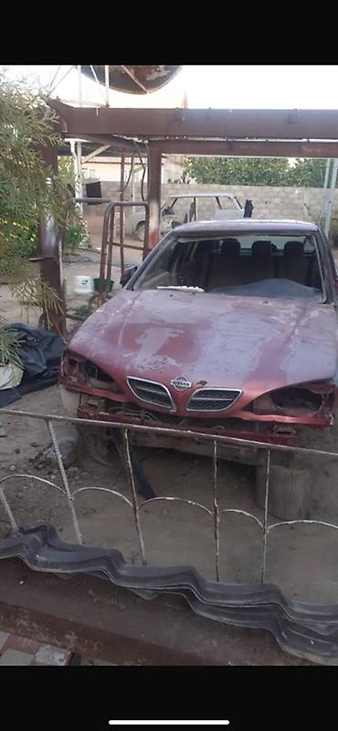 bye e2: Nissan Almera (седан), красный цвет, кузов P11. Описание: - — 1