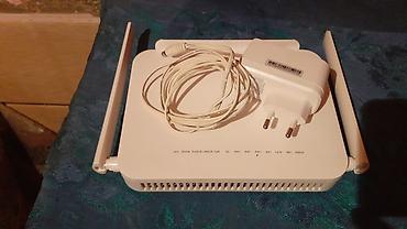 İki antenalı Wi‑Fi router + adapter Xüsusiyyətlər: - İki ədəd xarici