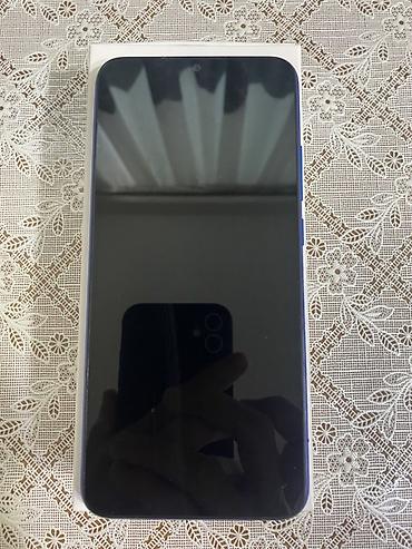 pixel 9a: Xiaomi Redmi (mavi rəng) - Ekran: təxminən 6” tam ekran, ön kamera — 1