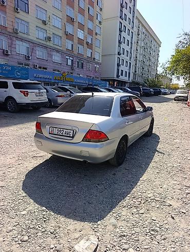 e34 2 5: Mitsubishi Lancer: 2002 г., 1.6 л, Автомат, Газ, Седан — 5