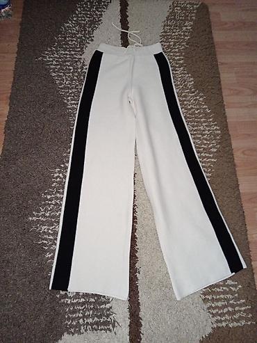 Haljine: Ženska odeća – set artikala 1) Pletene pantalone u krem boji sa crnim — 1