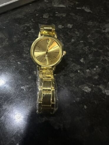 tək qaş uzuk qiymətləri: Qol saatı, Quartz, rəng - Qızılı