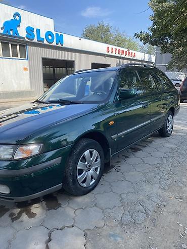х2 00: Mazda Capella: 2000 г., 2 л, Механика, Бензин, Универсал — 4