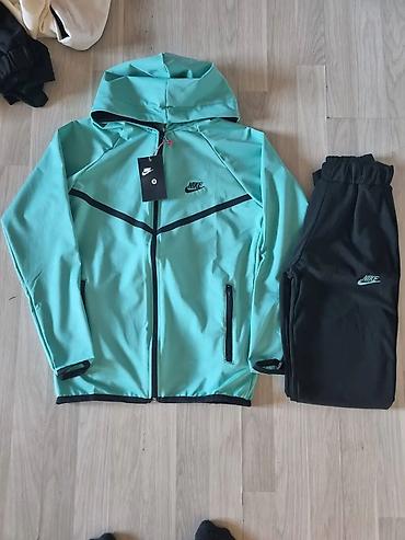 Gornji i donji deo: Ženska Nike trenerka – jakna sa kapuljačom + donji deo - Model — 9