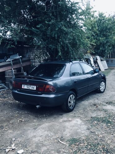 урулган машына: Mazda 323: 1996 г., 1.6 л, Механика, Бензин, Седан