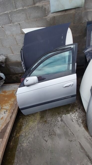кузов фит: Передняя левая дверь Toyota 2000 г., Б/у, цвет - Серебристый