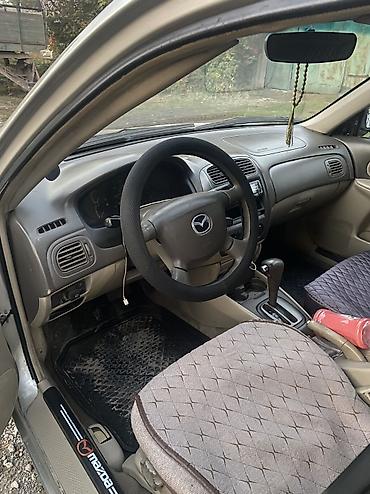 машина daihatsu: Mazda 323: 2001 г., 1.5 л, Автомат, Газ, Седан — 5