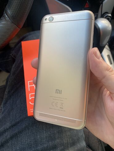 redmi5: Xiaomi Redmi 5A, 2 ГБ, цвет - Золотой, 
 Гарантия, Сенсорный, С документами