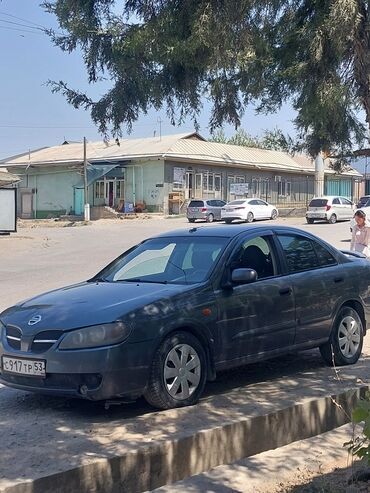 дейво нексия: Элегантный седан Nissan Almera темно-серого цвета, идеальный для