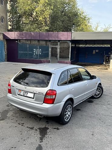 rexton j4: Mazda Familia: 2002 г., 1.6 л, Механика, Бензин, Хэтчбэк — 10