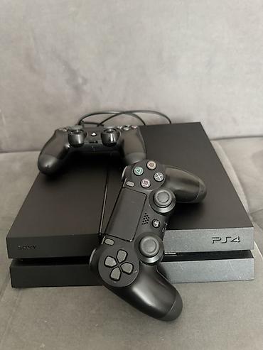 Игровая консоль Sony PlayStation 4 (PS4), черный цвет. 1 джостик