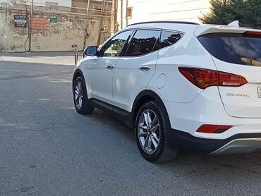 радиатор охлаждения опель вектра б: Ağ rəngli, dördqapılı "Hyundai Santa Fe" krossoveri. Avtomobilin