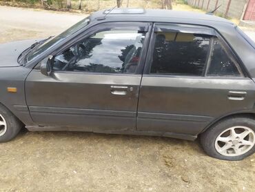 машина кейж: Mazda 121: 1996 г., 1.6 л, Механика, Бензин, Седан
