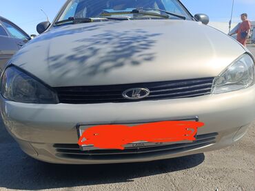 средний кузов да: Продается седан LADA Kalina в бежевом цвете, оснащенный литыми