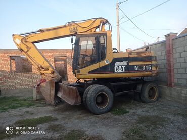 ассенизатор машина: Экскаватор, Caterpillar, 2000 г., Колесный