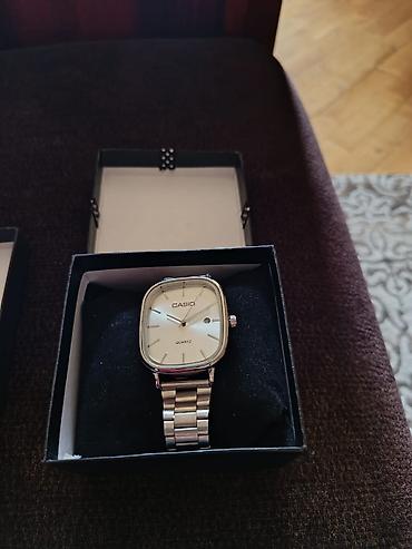 capa: Casio brendinə məxsus gümüşü metal kəmərli, kvars mexanizmli qol — 1