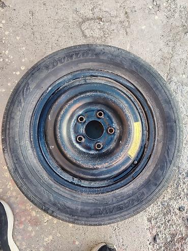 шина уаз: Докатка (запасное колесо на штатном стальном диске) - Шина: Dunlop — 1
