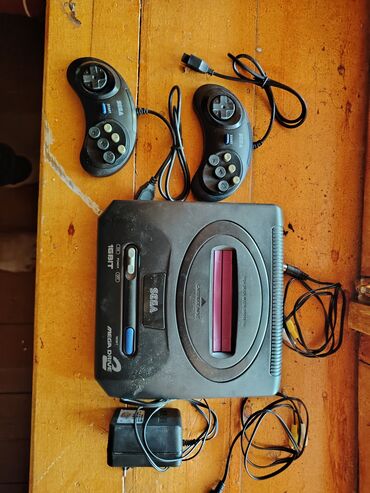 toshiba notebook adapter: Sega Mega Drive 2 oyun konsolu tam dəst halında təqdim olunur. Dəstə