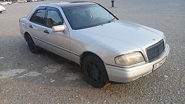скутер на номерах: Mercedes-Benz C-Class: 1994 г., Механика, Бензин, Седан — 2