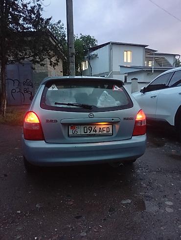 mers e210: Mazda 323: 2002 г., Механика, Хэтчбэк — 5