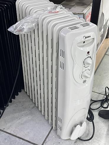 обогреватель домашний: Масляный радиатор Midea. Компактный напольный обогреватель для дома — 1