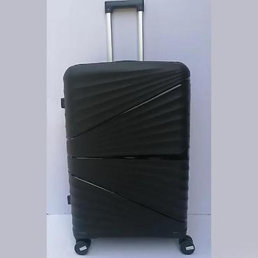 Putni koferi i torbe: Tvrdi kofer na točkiće – crni, sa šarama u dijagonalnom reljefu — 1