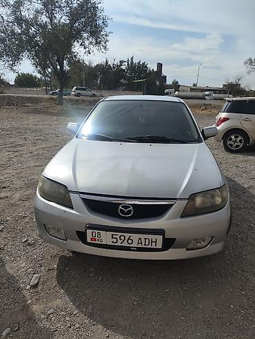 Транспорт: Mazda 323: 2002 г., 1.6 л, Механика, Бензин, Универсал — 7