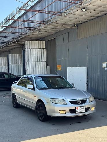 миша: Mazda Familia: 2002 г., 1.6 л, Механика, Бензин, Седан — 3
